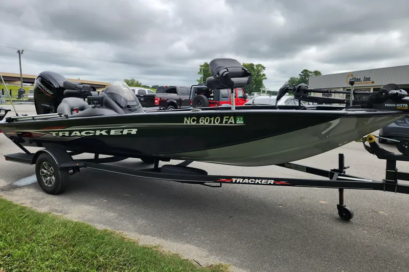 Slide: The Image of 2023 Tracker Pro Team 190 TX boat on trailer, parked outdoors. - 6