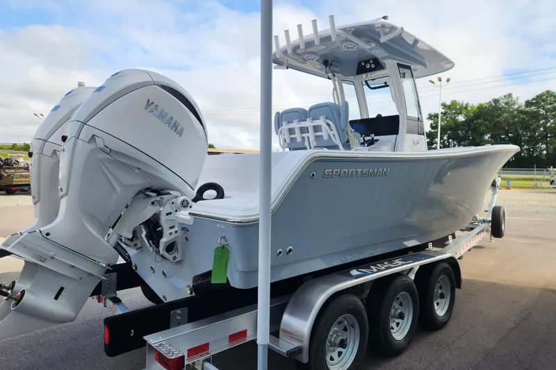 Slide: The Image of 2026 Sportsman Open 252 Center Console boat on trailer, featuring Yamaha engine. - 4