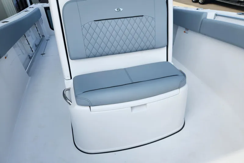 Slide: The Image of 2026 Sportsman Open 252 Center Console boat seat with gray cushioned upholstery. - 6