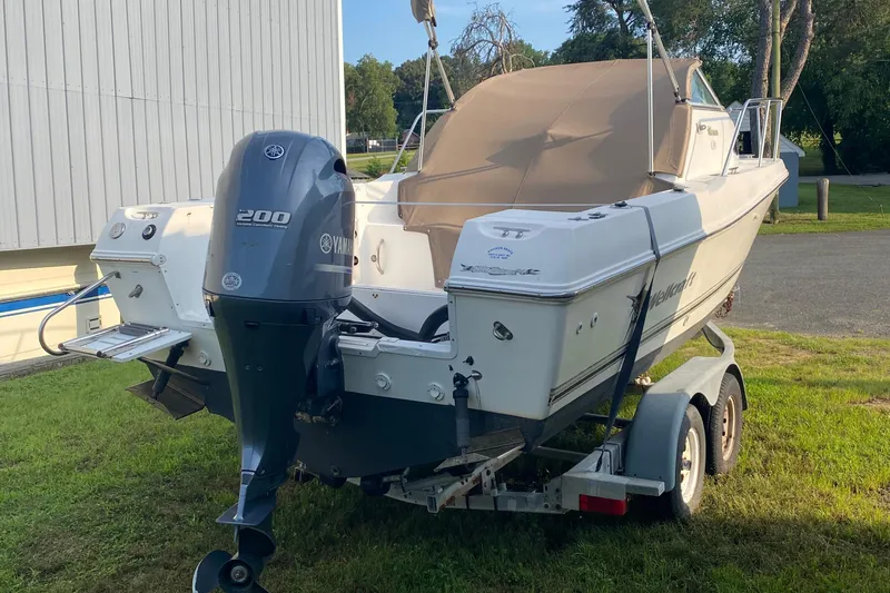 Slide: The Image of 2002 Wellcraft 24 Coastal Walkaround boat on trailer with Yamaha 200 outboard motor. - 3