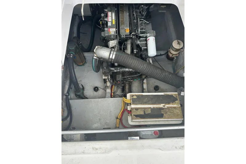Slide: The Image of Engine compartment of a 2002 Mainship Pilot 34 boat, showcasing mechanical components. - 30