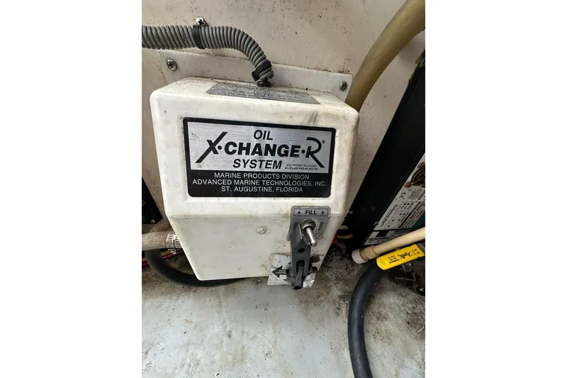 Slide: The Image of Oil X-Change-R system in 2002 Mainship Pilot 34 boat engine room. - 32