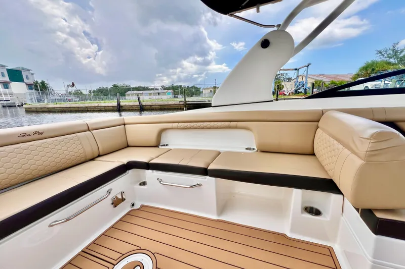 Slide: The Image of 2019 Sea Ray SDX 290 Outboard boat with luxurious tan seating and sleek design. - 13