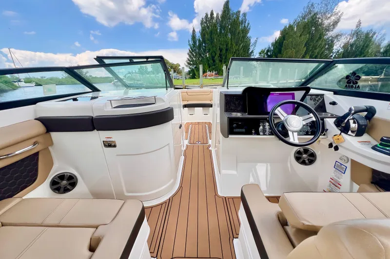Slide: The Image of 2019 Sea Ray SDX 290 Outboard boat interior with luxurious seating and modern dashboard. - 19