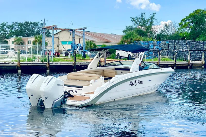 Slide: The Image of 2019 Sea Ray SDX 290 Outboard boat on water, featuring twin Mercury engines. - 7