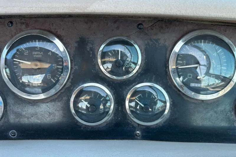 Slide: The Image of 1999 Sea Ray 330 Sundancer docked at marina under blue sky. - 15