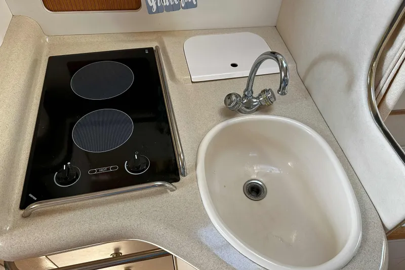 Slide: The Image of Dashboard gauges of a 1999 Sea Ray 330 Sundancer boat. - 18