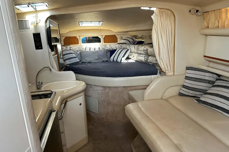 Slide: The Image of Cozy cabin interior of 1999 Sea Ray 330 Sundancer with comfortable bedding. - 22