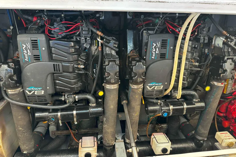 Slide: The Image of Twin MerCruiser V8 engines in a 1999 Sea Ray 330 Sundancer boat. - 33