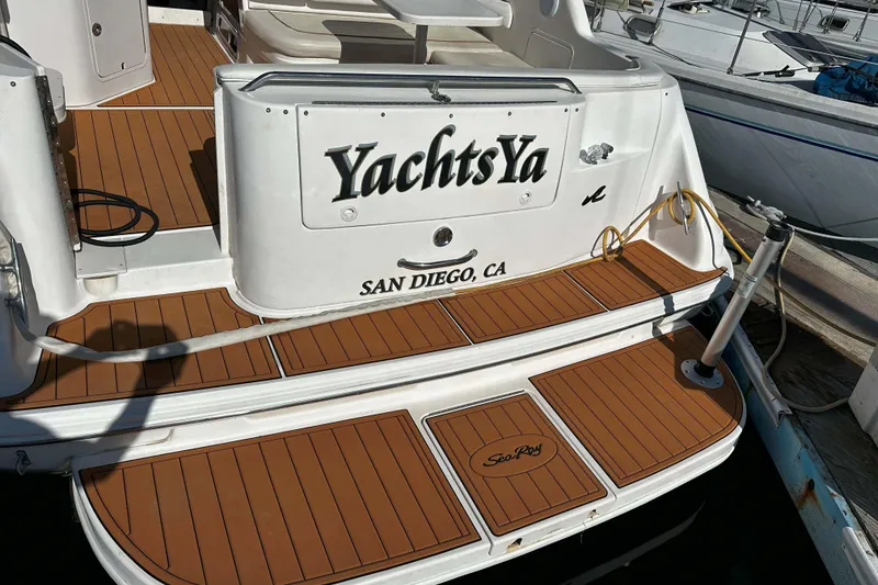 Slide: The Image of 1999 Sea Ray 330 Sundancer yacht docked in San Diego, featuring teak deck. - 8