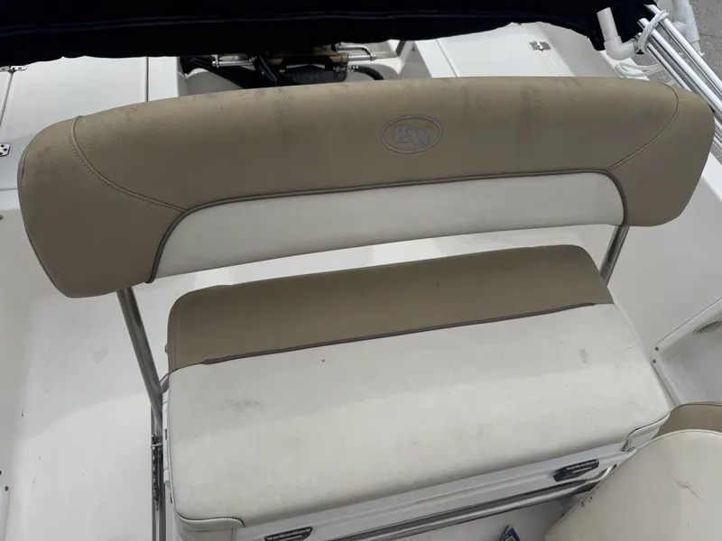 Slide: The Image of 2018 Key West 1720 Sportsman boat seat with beige and white upholstery. - 13