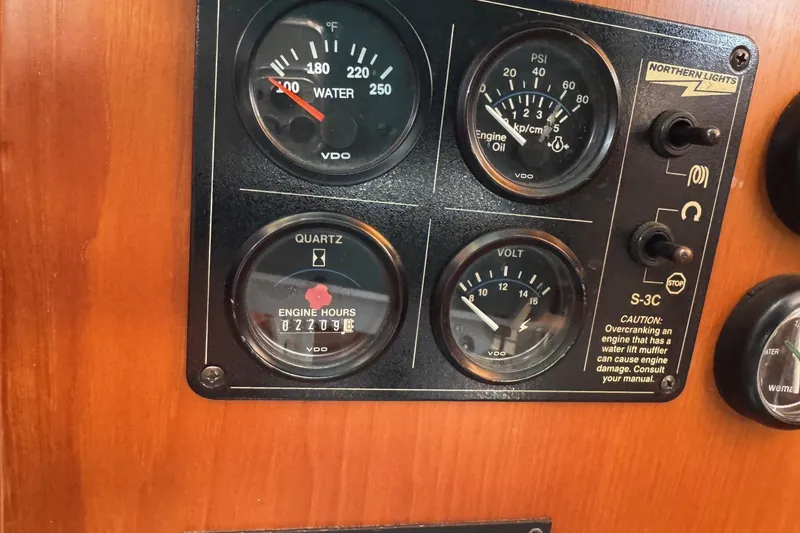 Slide: The Image of Instrument panel of a 2001 Kadey Krogen 48 boat with gauges and controls. - 15