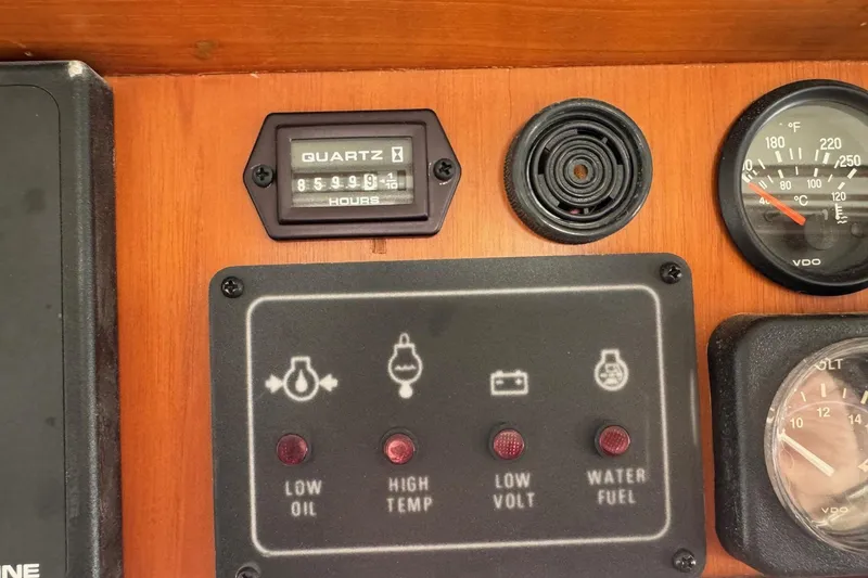 Slide: The Image of Control panel of a 2001 Kadey Krogen 48 boat with gauges and indicators. - 16