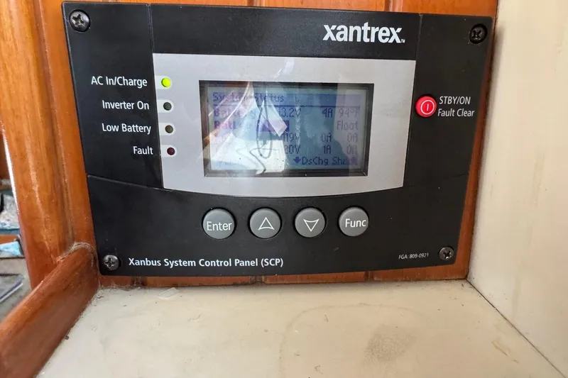 Slide: The Image of Xantrex control panel on 2001 Kadey Krogen 48 yacht, displaying system status. - 19