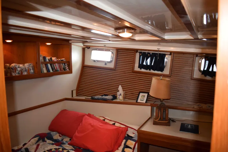 Slide: The Image of Cozy cabin interior of 2001 Kadey Krogen 48 yacht with bed, lamp, and bookshelves. - 20