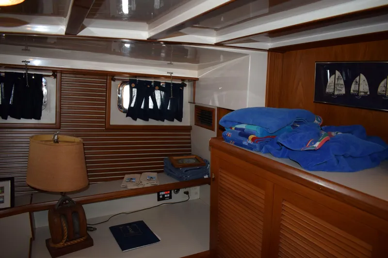 Slide: The Image of Interior of 2001 Kadey Krogen 48 yacht with wooden paneling and nautical decor. - 22