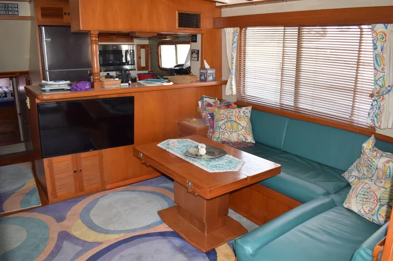 Slide: The Image of Interior of 2001 Kadey Krogen 48 yacht with cozy seating and modern kitchen. - 31