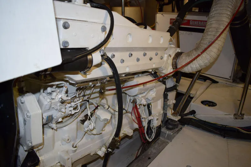 Slide: The Image of Engine room of a 2001 Kadey Krogen 48 yacht, showcasing mechanical components. - 36
