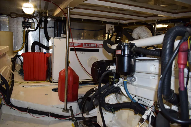 Slide: The Image of Engine room of 2001 Kadey Krogen 48 yacht with generator and wiring. - 37
