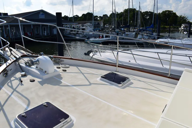 Slide: The Image of Kadey Krogen 48 yacht deck, 2001 model, docked at a marina with other boats. - 39