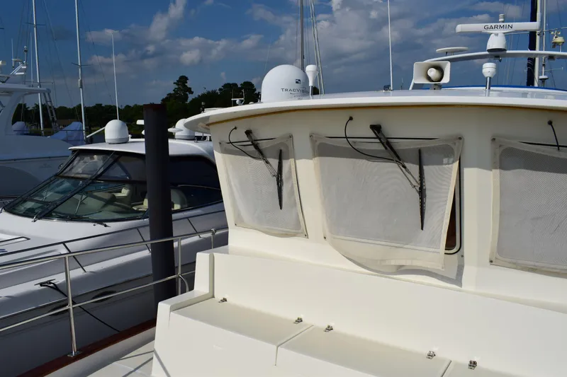 Slide: The Image of Kadey Krogen 48 yacht, 2001 model, docked with clear skies in the background. - 40