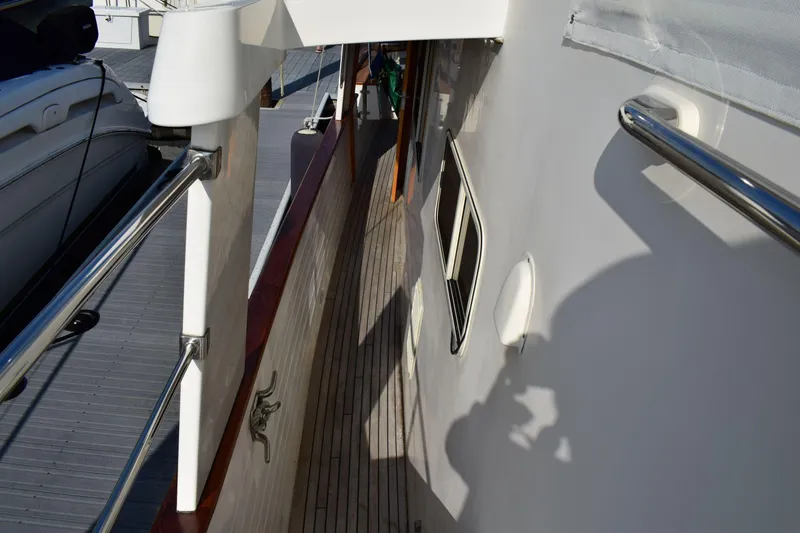 Slide: The Image of Side deck view of 2001 Kadey Krogen 48 yacht with stainless steel railings. - 41