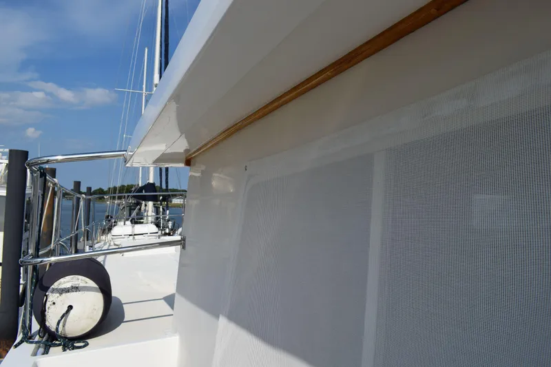 Slide: The Image of Side view of a 2001 Kadey Krogen 48 yacht docked at a marina. - 42