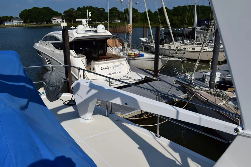 Slide: The Image of Kadey Krogen 48 yacht, 2001 model, docked at marina with other boats. - 44