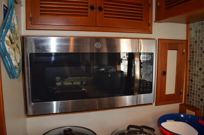 Slide: The Image of Stainless steel microwave in Kadey Krogen 48 yacht kitchen, 2001 model. - 7