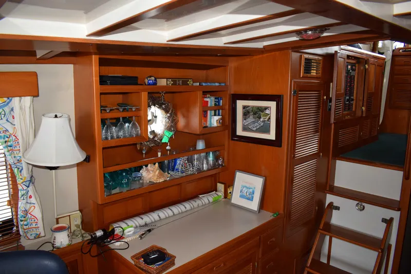 Slide: The Image of Interior of 2001 Kadey Krogen 48 yacht with wooden cabinetry and nautical decor. - 8