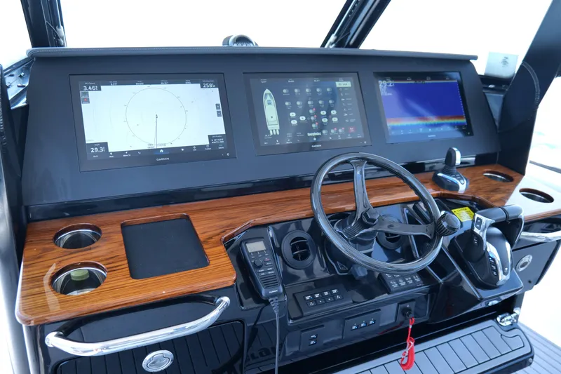Slide: The Image of 2024 Everglades 395 Center Console dashboard with advanced navigation and control systems. - 11
