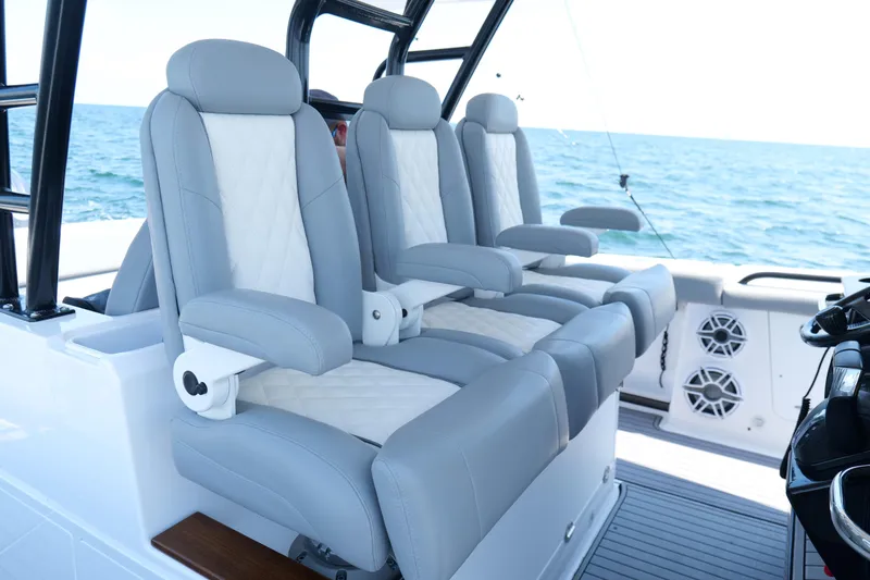 Slide: The Image of Luxurious seating on 2024 Everglades 395 Center Console boat, ocean backdrop. - 17