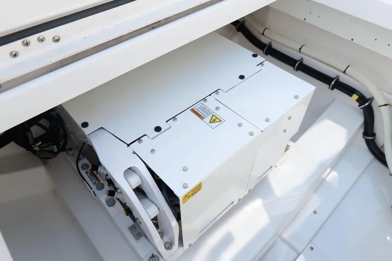 Slide: The Image of 2024 Everglades 395 Center Console engine compartment with electrical components and wiring. - 19