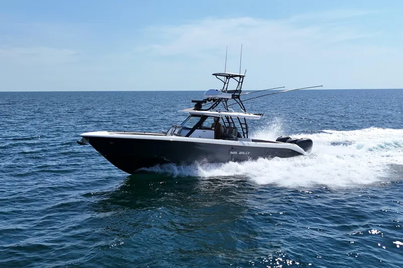 Slide: The Image of 2024 Everglades 395 Center Console boat cruising on open ocean waters. - 2