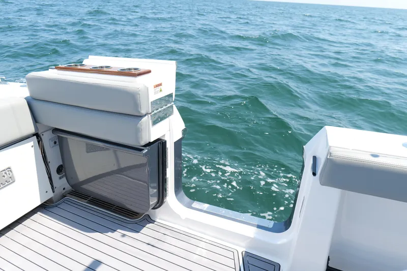 Slide: The Image of 2024 Everglades 395 Center Console boat with open side door, ocean view. - 29