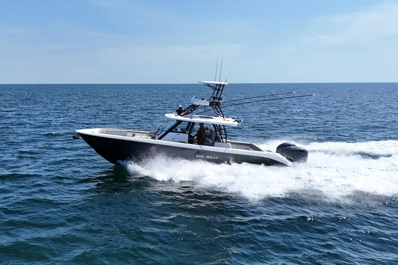 Slide: The Image of 2024 Everglades 395 Center Console boat cruising on open ocean waters. - 3