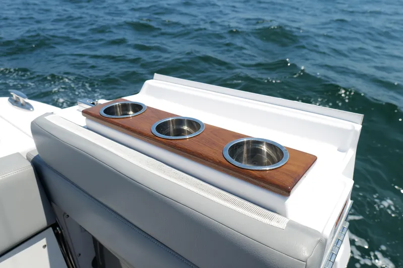 Slide: The Image of 2024 Everglades 395 Center Console boat with stylish cup holders on deck. - 30