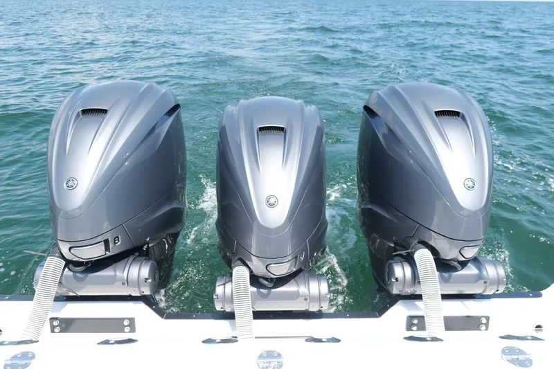 Slide: The Image of Triple outboard engines on 2024 Everglades 395 Center Console in open water. - 34