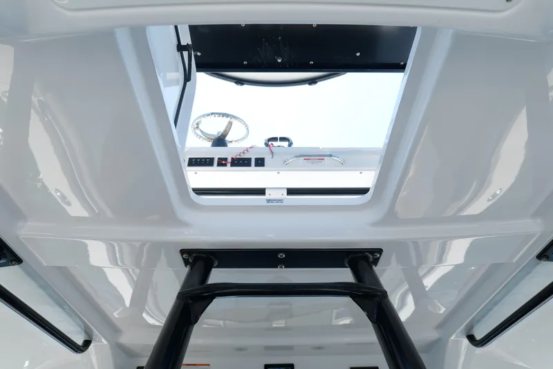 Slide: The Image of 2024 Everglades 395 Center Console interior view, showcasing helm and controls. - 38