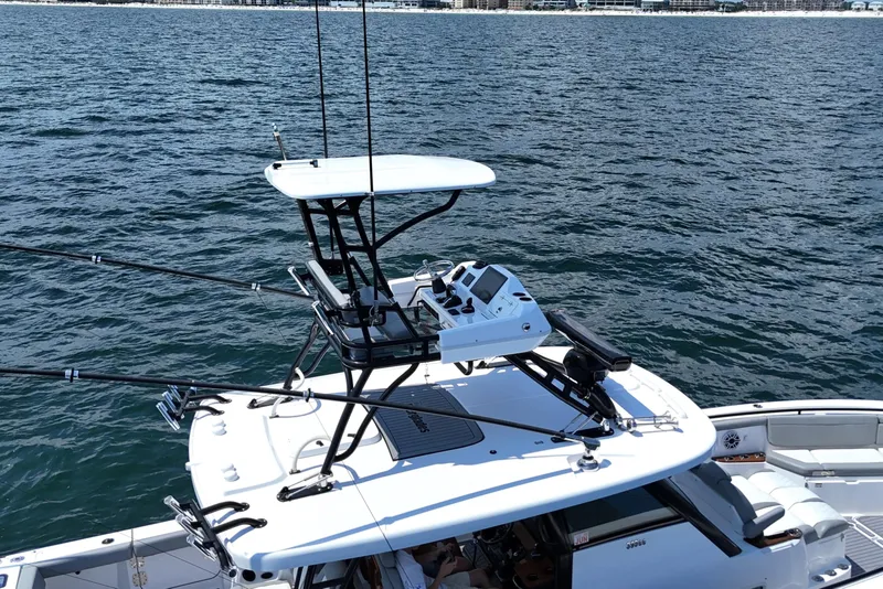 Slide: The Image of 2024 Everglades 395 Center Console boat on open water, featuring advanced navigation equipment. - 39