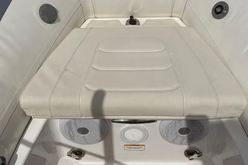 Slide: The Image of 2021 Williams Jet Tenders SportJet 395 interior seating with speakers and storage compartment. - 10