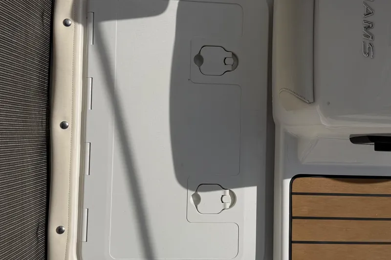 Slide: The Image of 2021 Williams Jet Tenders SportJet 395 deck with storage compartments and seating area. - 9