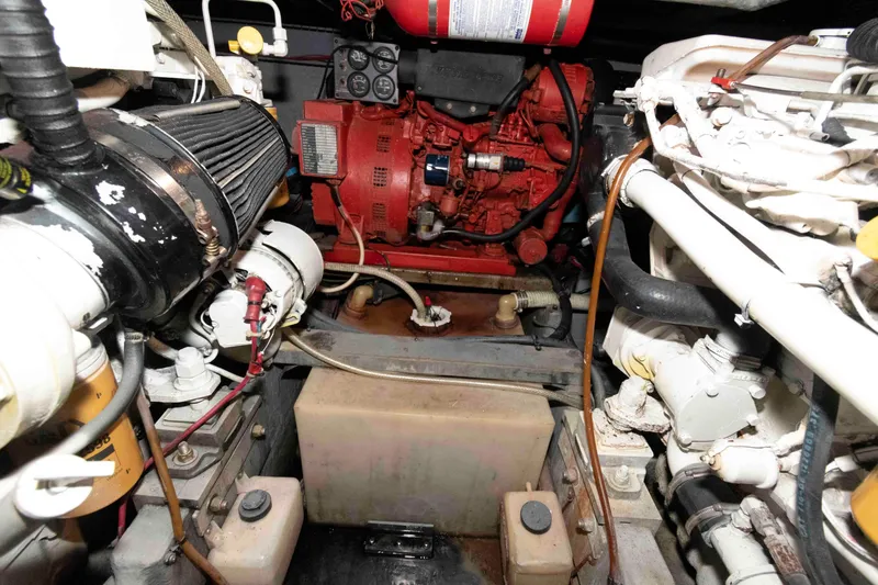 Slide: The Image of Engine room of a 1998 Sea Ray 370 Aft Cabin boat, showcasing mechanical components. - 27