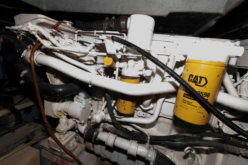 Slide: The Image of Engine compartment of a 1998 Sea Ray 370 Aft Cabin with CAT filters visible. - 28