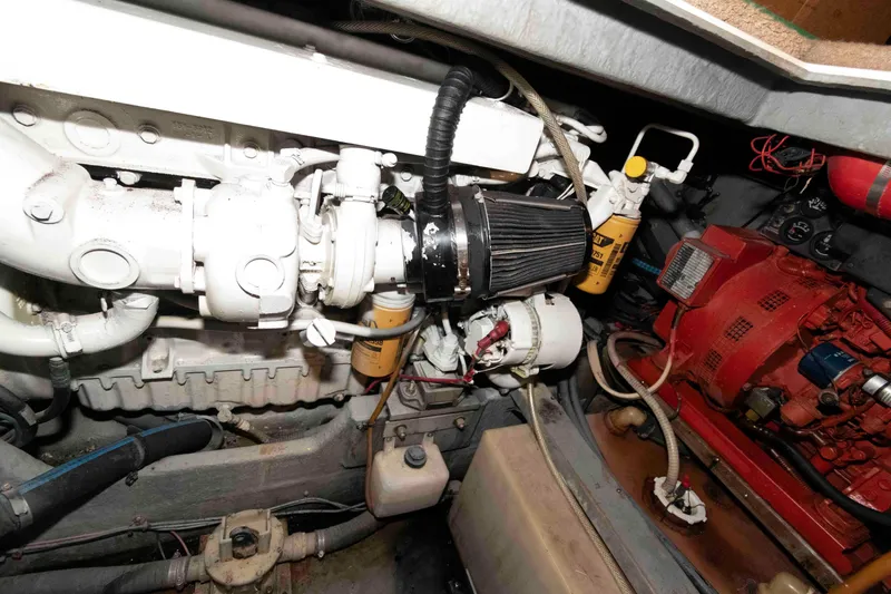 Slide: The Image of Engine compartment of a 1998 Sea Ray 370 Aft Cabin boat, showcasing mechanical components. - 29