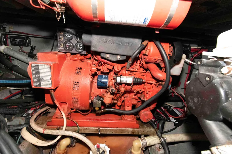 Slide: The Image of Engine compartment of a 1998 Sea Ray 370 Aft Cabin boat, featuring a Westerbeke generator. - 30