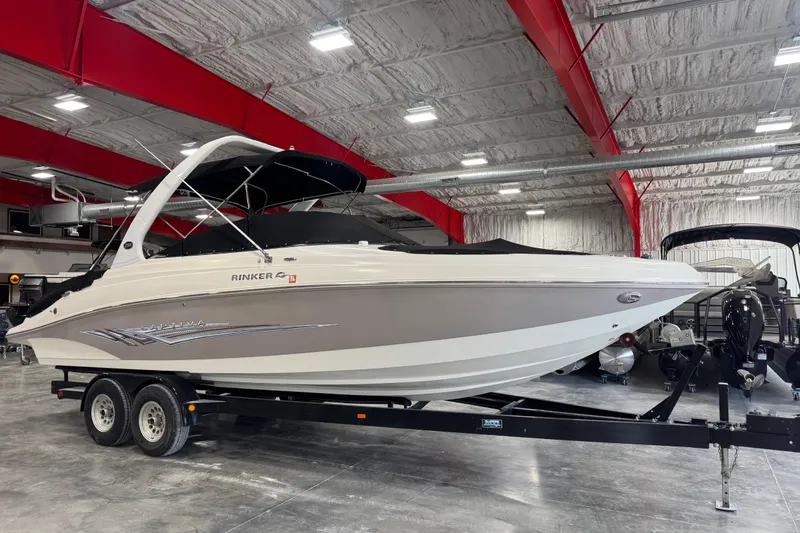 Slide: The Image of 2008 Rinker 296 Captiva Bowrider boat on trailer in indoor showroom. - 14
