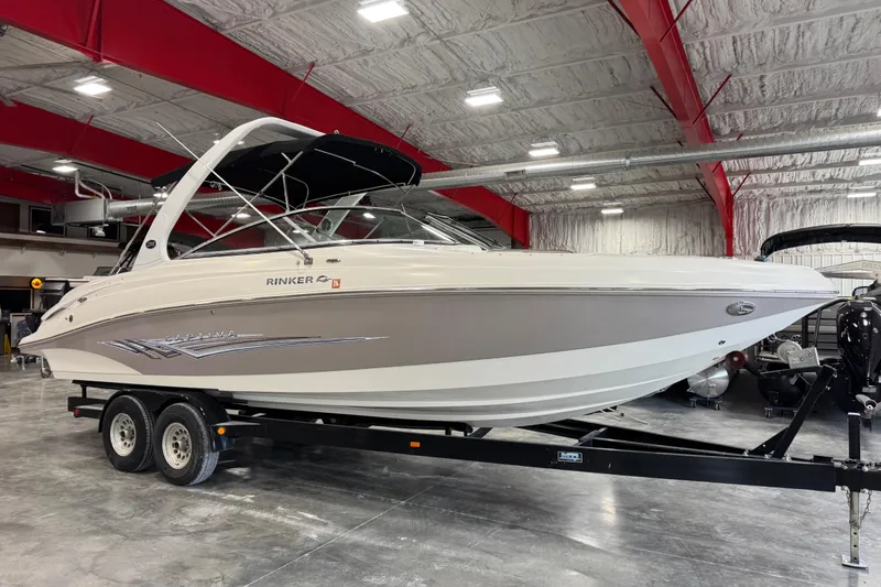 Slide: The Image of 2008 Rinker 296 Captiva Bowrider on trailer in indoor showroom. - 2