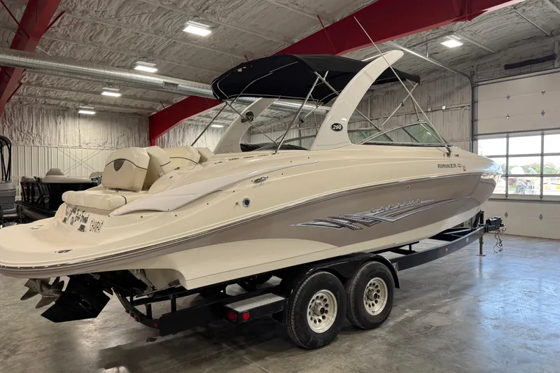Slide: The Image of 2008 Rinker 296 Captiva Bowrider boat on trailer in indoor storage facility. - 4