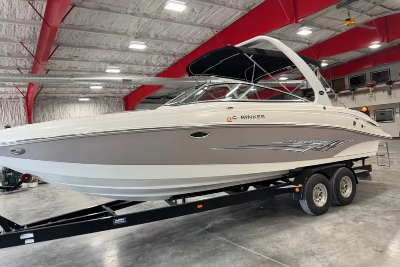 Slide: The Image of 2008 Rinker 296 Captiva Bowrider boat on trailer in indoor storage facility. - 5